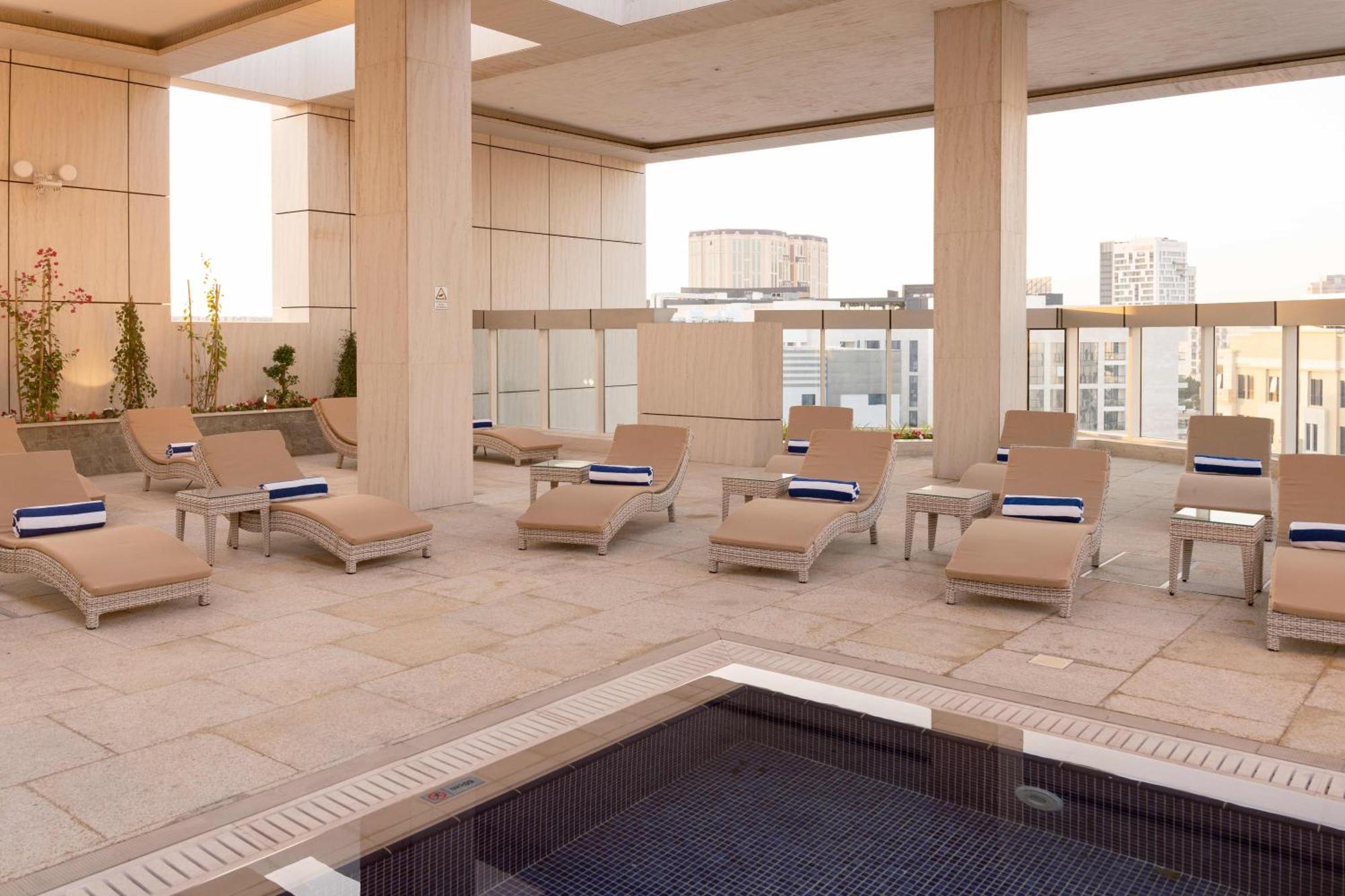 Millennium Place Doha Exterior photo The rooftop pool at the Four Seasons Hotel