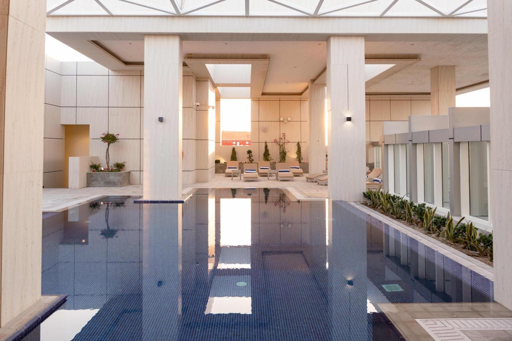 Millennium Place Doha Exterior photo The pool at the 1018